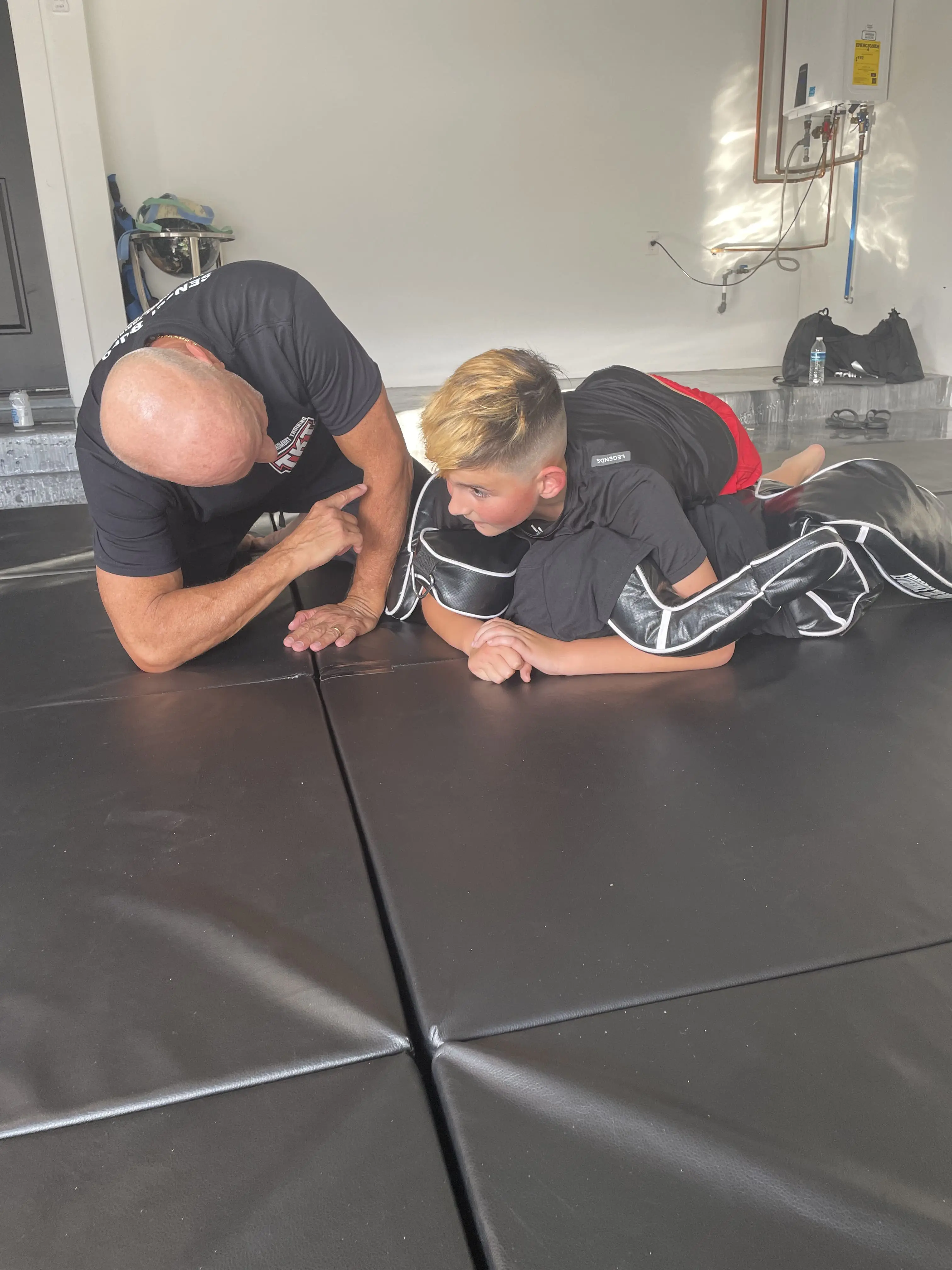 Child receiving belt promotion at home